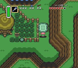 Link lifting a large stone in the path
