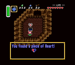 Link finding piece of heart in the cave